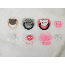 Choose any four pacifiers from the baby doll